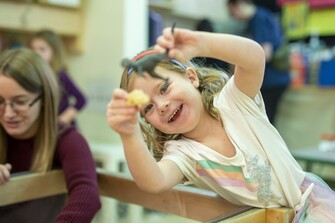 young child playing with toys